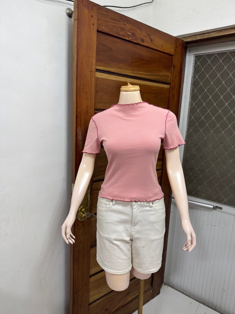 GU Pink Ribbed T-shirt (Category: Shirts) located in Cavite. Submitted by yakultjeni85475 (Listing ID 1439562119, Image 3). Description: - Pink ribbed t-shirt from GU - Features a mock neck and short sleeves - Subtle textured design - Flattering fit - Versatile for various styling options (see second image) - Perfect for a casual chic look.