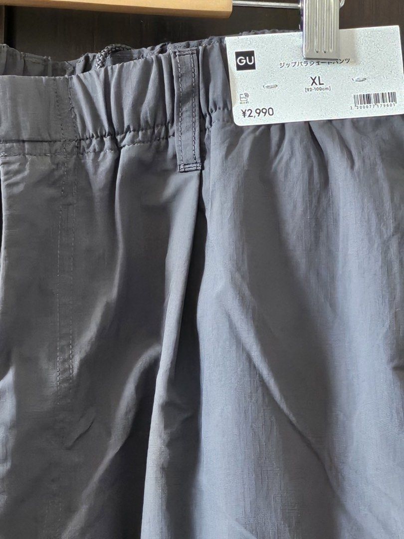 GU Zip Parachute Pants XL (Category: Other Bottoms) located in Makati City. Submitted by stephdzn (Listing ID 1439486800, Image 2). Description: - GU Zip Parachute Pants - Size: XL - Color: Gray - Features: Drawstring hem, zip closure, side pocket - Fit: Relaxed - Condition: Brand new with original tags Waist 34-38.