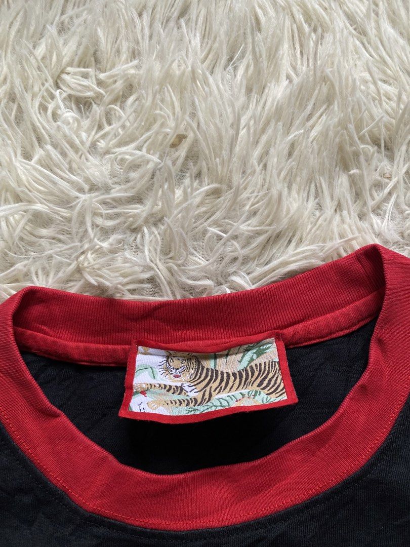 Gucci Cat Graphic T-shirt (Category: Tshirts & Polo Shirts ) located in Iloilo. Submitted by illcitythriftedco. (Listing ID 1439565488, Image 3). Description: - Eye-catching cat graphic on the front - Red collar and Gucci logo in red - Includes tiger graphic tag - Size: Medium.