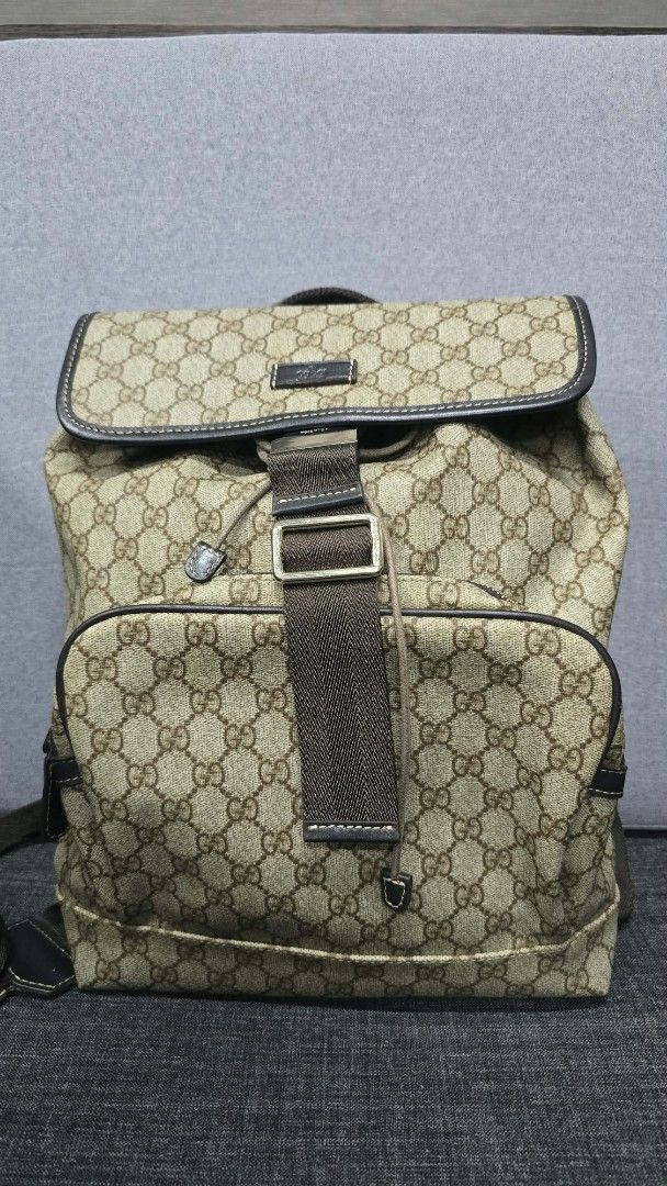 Gucci GG Supreme Backpack (Category: Backpacks) located in General Trias. Submitted by roselle2230 (Listing ID 1439513297, Image 1). Description: - Authentic Gucci backpack - Iconic GG Supreme canvas - Adjustable shoulder straps - Top handle - Flap closure with buckle - Interior pocket with Gucci label - Includes authenticity cards - Classic Gucci pattern.