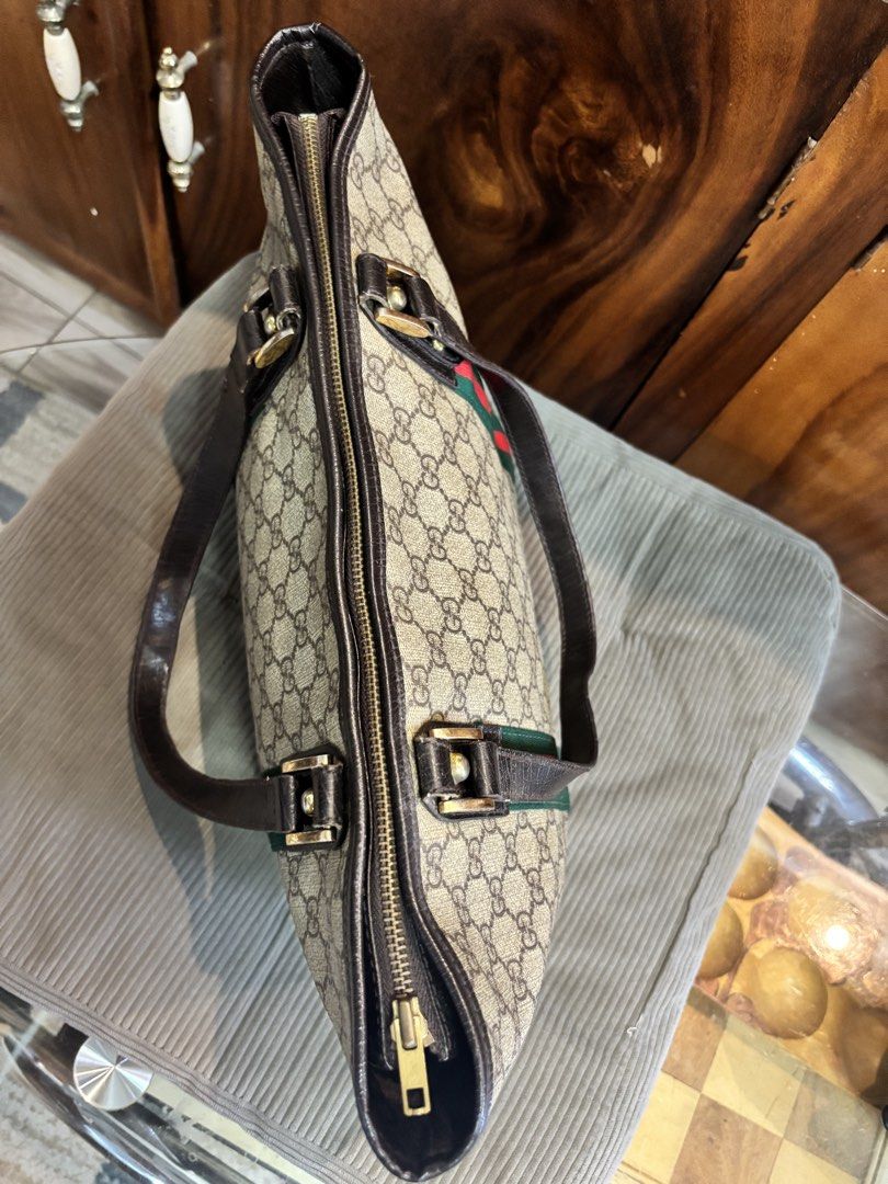 Gucci sherry line tote bag (Category: Luxury Bags & Wallets) located in Imus. Submitted by bagsofblessings24 (Listing ID 1439489880, Image 2). Description: Preloved Gucci sherry line tote bag Medium size Coded Very good condition No rubs on the corners Sign of use is the fading of hardware and crack on strap but still durable Length 11.5in x Height 9.5in x Bottom 4in Guaranteed by source to be original but since this is vintage, should be examine