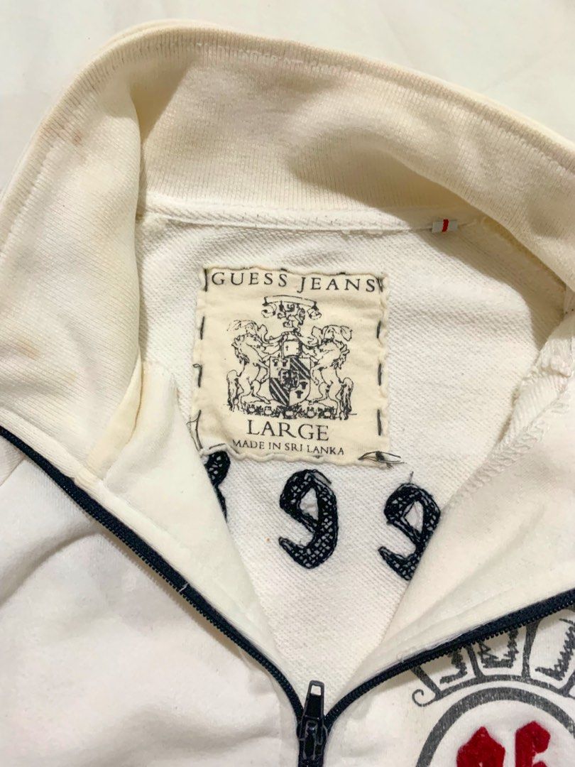 Guess Jeans White Jacket - Large (Category: Coats, Jackets and Outerwear) located in Paranaque City. Submitted by vbvessentials (Listing ID 1439560179, Image 3). Description: - White Guess Jeans jacket - Full zip closure - Front design: "13th Annual CE" - Back graphic: "Freedom Race" - Black and white striped sleeves - Size: Large - Bought in the USA Flaws: some stains but not too obvious.