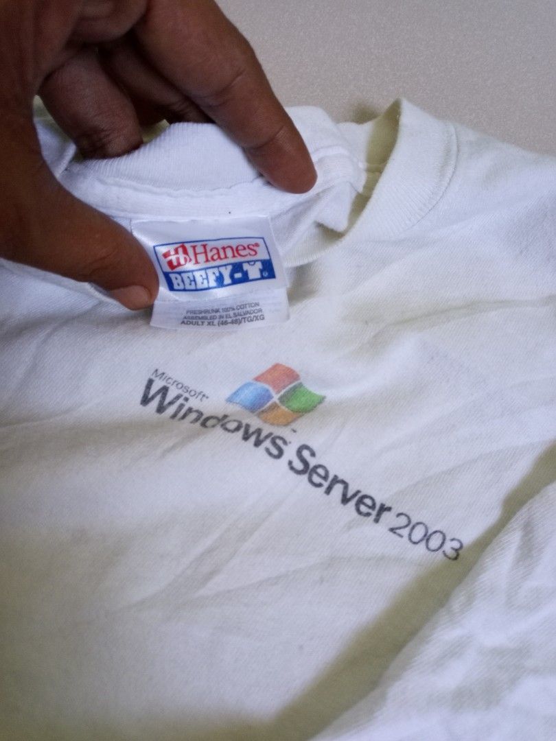 Hanes Windows Server 2003 Training Tour T-shirt (Category: Tshirts & Polo Shirts ) located in Manila. Submitted by onewikstraight (Listing ID 1439467642, Image 3). Description: - Vintage Hanes Beefy-T T-shirt - From the Windows Server 2003 Training Tour - Features the Windows Server 2003 logo on the front - Training tour design on the back - Back design highlights scalability and "Do more with less" - Classic white color - Size XL - Perfect for c