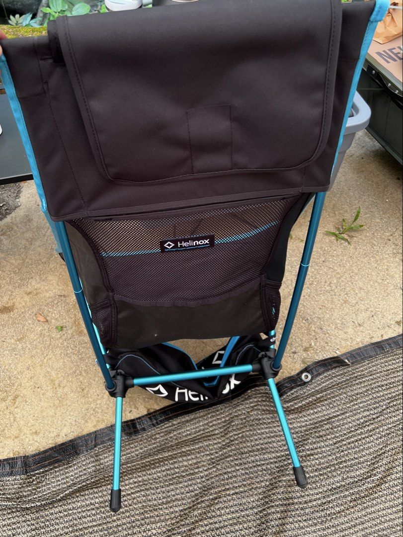 Helinox Chair Two (Category: Hiking & Camping) located in Petaling Jaya. Submitted by iam1701 (Listing ID 1439607222, Image 2). Description: - Helinox Chair Two camping chair - Black seat with blue trim - Mesh back for breathability - Foldable and lightweight design - Helinox logo visible - Suitable for outdoor use.