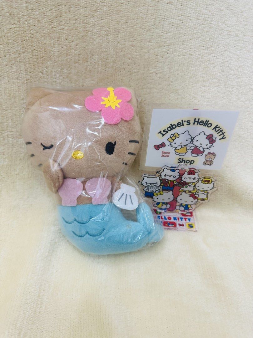 Hello Kitty TAN Mermaid Plush Toy (Category: Plushies & Soft Toys) located in Angeles City. Submitted by IsaCRSL (Listing ID 1439454044, Image 1). Description: - Adorable Kitty mermaid plush toy - Features a brown Kitty - Pink flower on her head - Blue mermaid tail - Comes with clear plastic packaging 100% original from Japan and 100% free shipping .