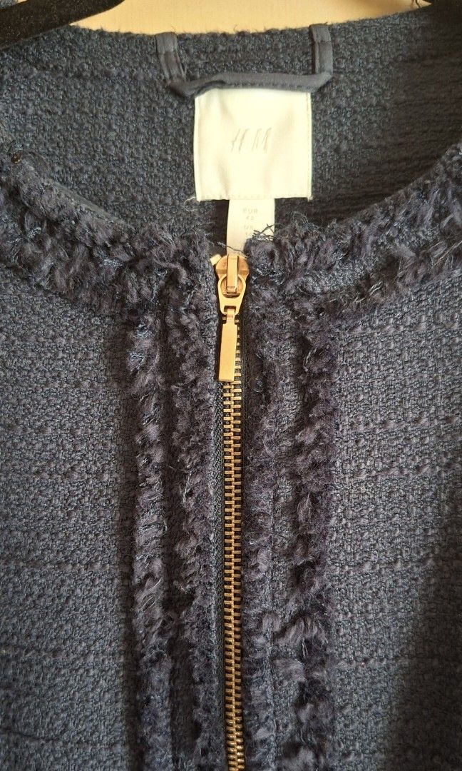 H&M Navy Blue Tweed Coat (Category: Coats, Jackets and Outerwear) located in Manila. Submitted by thrifter_lifestyle (Listing ID 1439422297, Image 3). Description: Brand: H&M Full gold zipper enclosure Raw frayed design including in collar, wrists Two big pockets in front Falls long, lands within hip area. L: 32.5" B: 42" W: 38" Color: Navy Blue Material: See tag, tweed material outer with navy lining Style is a cross between a blazer and coat 🙂