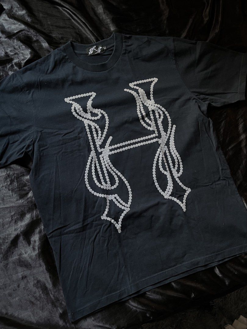 Hooligans Logo Navy Blue (Category: Tshirts & Polo Shirts ) located in Manila. Submitted by ms.dontplaywithme (Listing ID 1439529810, Image 1). Description: - Black t-shirt - White stylized 'H' graphic (beaded/pearl-like design) - Crew neck - Short sleeves - Soft, comfortable fabric.