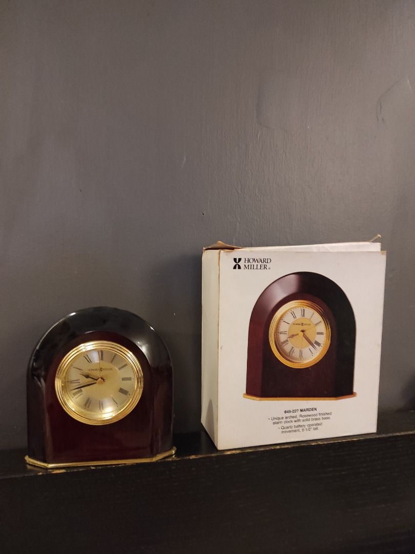 Howard Miller Wooden Clock Marden (Category: Clocks) located in Manila. Submitted by allmustgomnl (Listing ID 1439606790, Image 2). Description: - Howard Miller clock Marden 645-227 - Wooden case with gold-tone accents - Round clock face with Roman numeral hour markers - Rich, dark wood finish - Classic design - Ideal for home decor P5000 Mop gcash, bank transfer Delivery buyer's Expense .