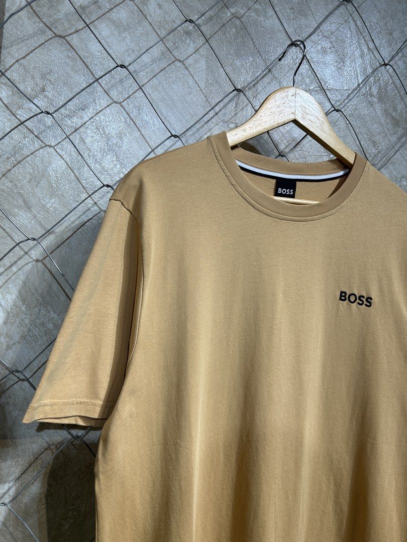 Hugo Boss T-shirt (Category: Tshirts & Polo Shirts ) located in Manila. Submitted by ardobe.mnl (Listing ID 1439467470, Image 2). Description: Boss Chest Logo Brown Tee. Size: Large-XL Dimes: 22x30 Condition: Good asnew Flaw: None! Mine: Dm to purchase! 📥.