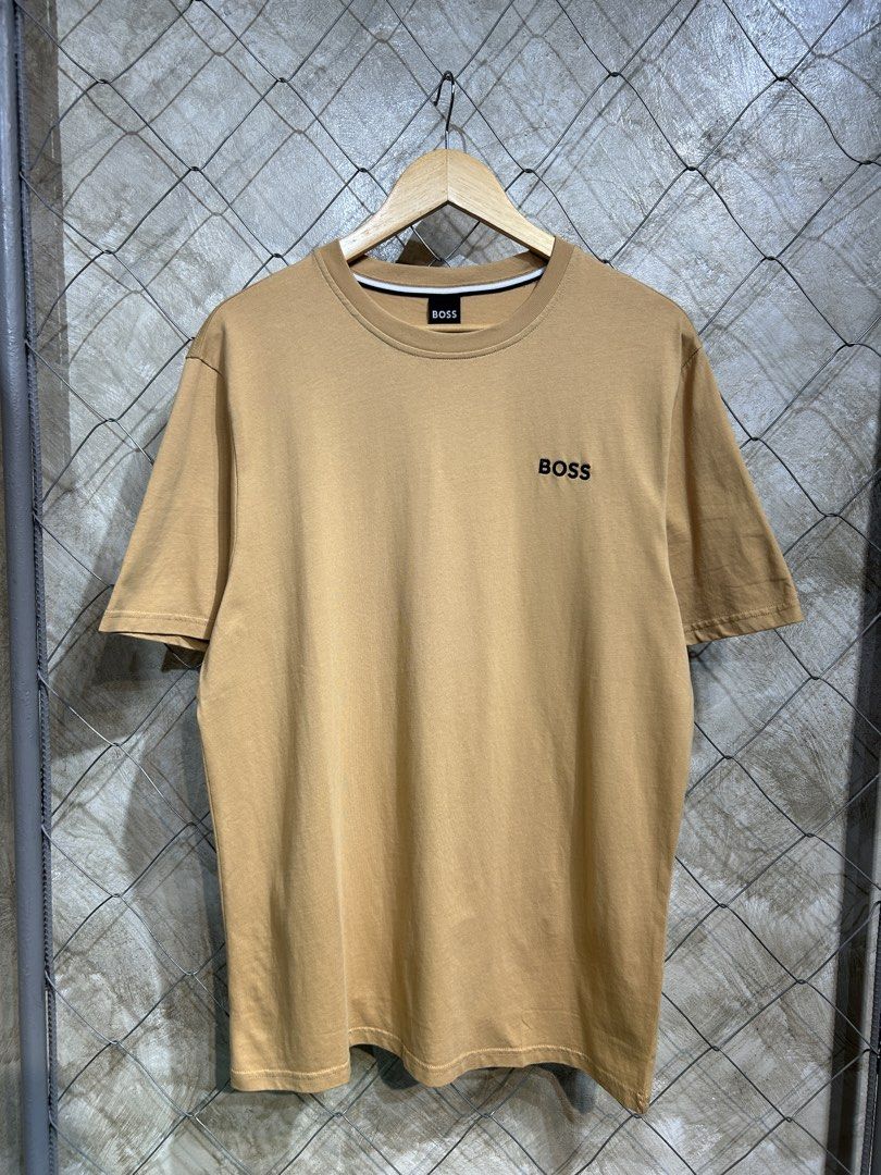 Hugo Boss T-shirt (Category: Tshirts & Polo Shirts ) located in Manila. Submitted by ardobe.mnl (Listing ID 1439467470, Image 1). Description: Boss Chest Logo Brown Tee. Size: Large-XL Dimes: 22x30 Condition: Good asnew Flaw: None! Mine: Dm to purchase! 📥.