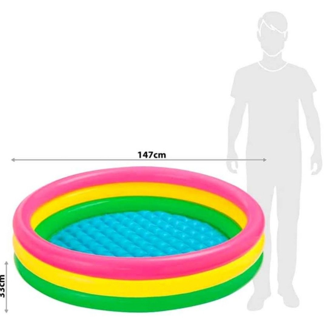 Intex Sunset Glow Pool 147cm (Category: Infant Playtime) located in Manila. Submitted by reytinay (Listing ID 1439467255, Image 3). Description: - Intex Sunset Glow Pool for kids - Diameter: 147cm - Height: 33cm - Features colorful pink, yellow, and green rings - Includes a small inflatable ring - Electric pump available (Free).