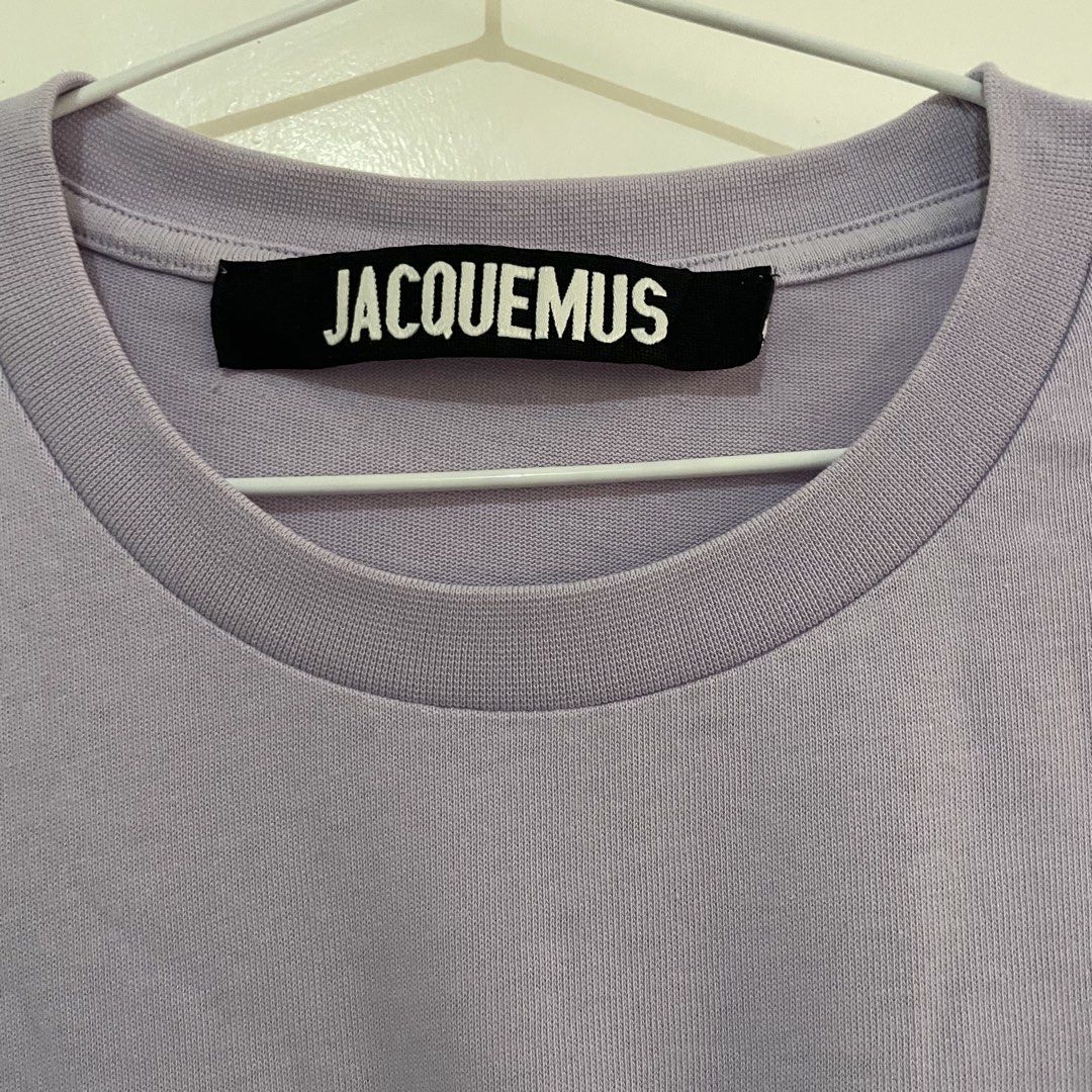 JACQUEMUS Sunflower T-shirt (Category: Shirts) located in Leyte. Submitted by byebabies (Listing ID 1439563794, Image 3). Description: Lavender Jacquemus T-shirt featuring a sunflower graphic on the front. It has a crew neck and short sleeves. The brand label is visible on the neck and the size tag indicates size S. Made in Portugal. All items NEGOTIABLE for SAME DAY PAYMENT Do not offer 50% from its price Everything priced below 500 can be sold 