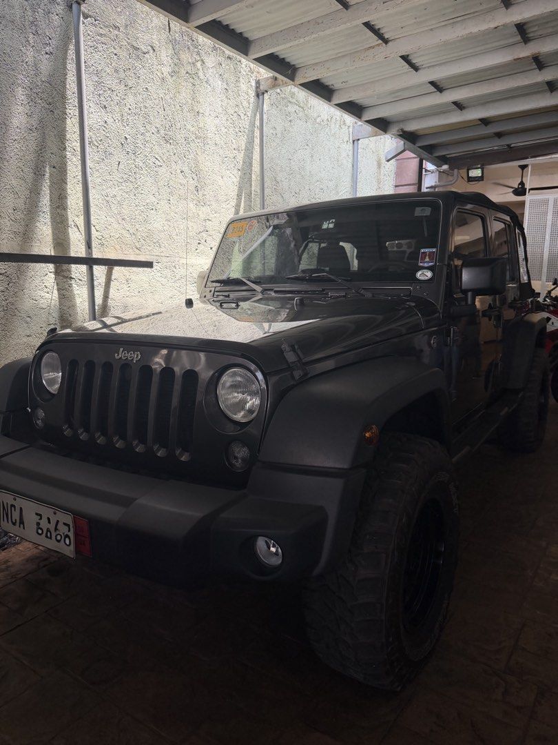 Jeep Wrangler Unlimited 4.0 (A) (Category: Used Cars) located in Quezon City. Submitted by ramosieee (Listing ID 1439505913, Image 3). Description: Asking price: ₱2.3M 2018 Jeep Wrangler 3.6L U 12,000 mileage only Soft top CASA maintained Automatic Transmission Ending plate #3 Color: Granite Gray 4x4 Engine 2 Original Keys Comprehensive Insurance until Feb 2027 LTO/HPG Verified Complete Original Documents ZERO History of Accident / Flood Guarante