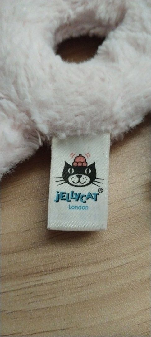 Jellycat Pink Bunny Rattle (Category: Toys & Games) located in Caloocan City. Submitted by izzyjelly (Listing ID 1439508380, Image 3). Description: Adorable Jellycat bunny rattle is a soft and cuddly toy. It features a pink color and a unique ring-shaped body. The bunny has long floppy ears and a cute face. The tag indicates it is made in China. Perfect for babies and young children. Location📍North Caloocan MOD: Lalamove or JnT MOP: Gcash ✅Can s