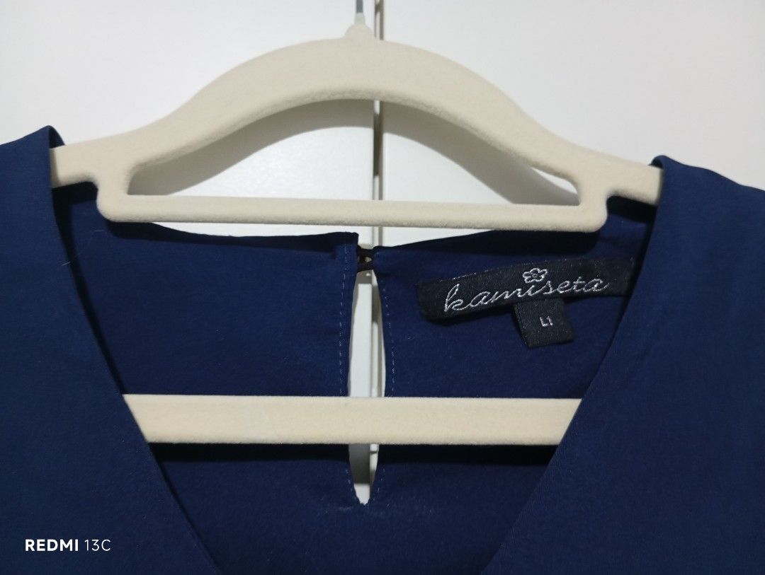 Kamiseta Navy Blue Blouse - Size L (Category: Blouses) located in Manila. Submitted by khrodi (Listing ID 1439494151, Image 3). Description: - Kamiseta navy blue blouse - Size: L1 - Features a V-neckline - Short sleeves - Keyhole detail at the back - Made of smooth, lightweight fabric - Suitable for casual and office wear - brand new, washed, no tag.