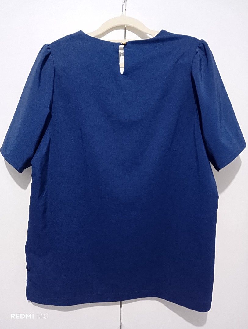 Kamiseta Navy Blue Blouse - Size L (Category: Blouses) located in Manila. Submitted by khrodi (Listing ID 1439494151, Image 2). Description: - Kamiseta navy blue blouse - Size: L1 - Features a V-neckline - Short sleeves - Keyhole detail at the back - Made of smooth, lightweight fabric - Suitable for casual and office wear - brand new, washed, no tag.