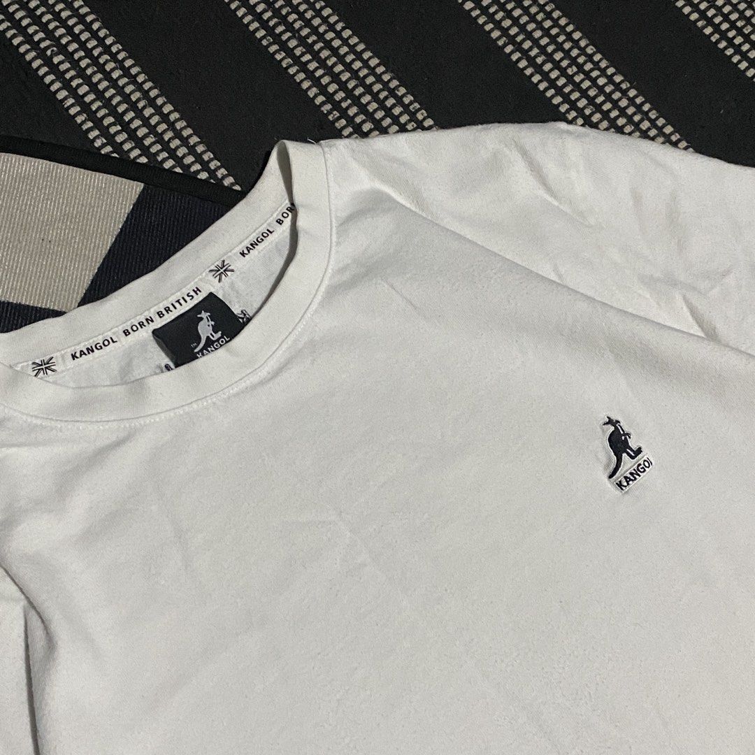 Kangol White T-Shirt (Category: Tshirts & Polo Shirts ) located in Gapan. Submitted by thrftfnds (Listing ID 1439464181, Image 2). Description: 💎 KANGOL DIMES: 19x27 COLOR RATE: 9/10 FLAWS: LINTS & STAINS PRICE: 300+SF.