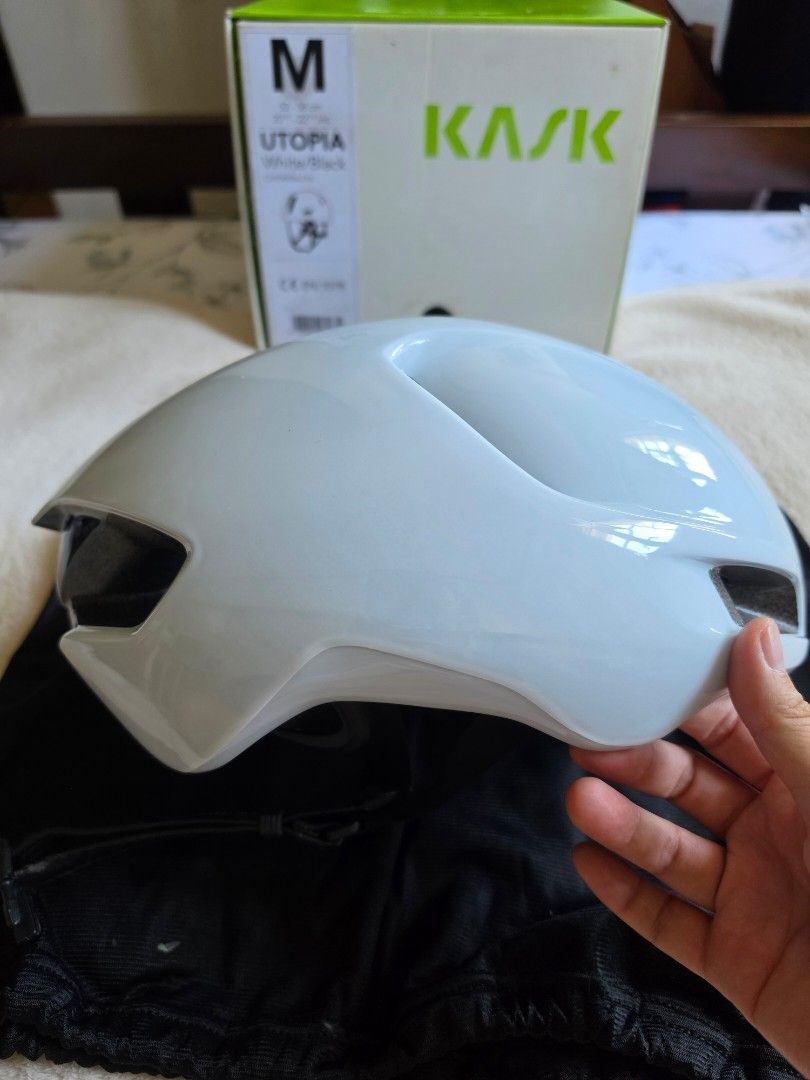 Kask Utopia White Helmet - Size M (Category: Bicycles) located in Paranaque City. Submitted by krisfuentes (Listing ID 1439469468, Image 3). Description: Dent/scratch on left side (outside) but intact inside - Kask Utopia cycling helmet - White color - Size M - Includes original box - Multiple vents for airflow - Padded interior with adjustable straps - Kask logo visible.