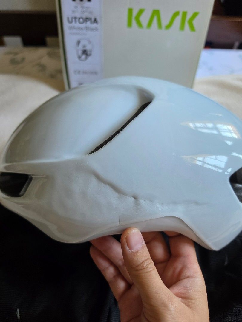 Kask Utopia White Helmet - Size M (Category: Bicycles) located in Paranaque City. Submitted by krisfuentes (Listing ID 1439469468, Image 2). Description: Dent/scratch on left side (outside) but intact inside - Kask Utopia cycling helmet - White color - Size M - Includes original box - Multiple vents for airflow - Padded interior with adjustable straps - Kask logo visible.