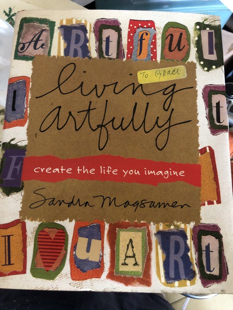 Living Artfully by Sandra Magsamen (Category: Storybooks) located in Quezon City. Submitted by safedragon_2306ab257 (Listing ID 1439434907, Image 1). Description: - "Living Artfully" by Sandra Magsamen - Brown cover with cursive title - Features "create the life you imagine" - Colorful letter cutouts - Includes a note: "To Grace".