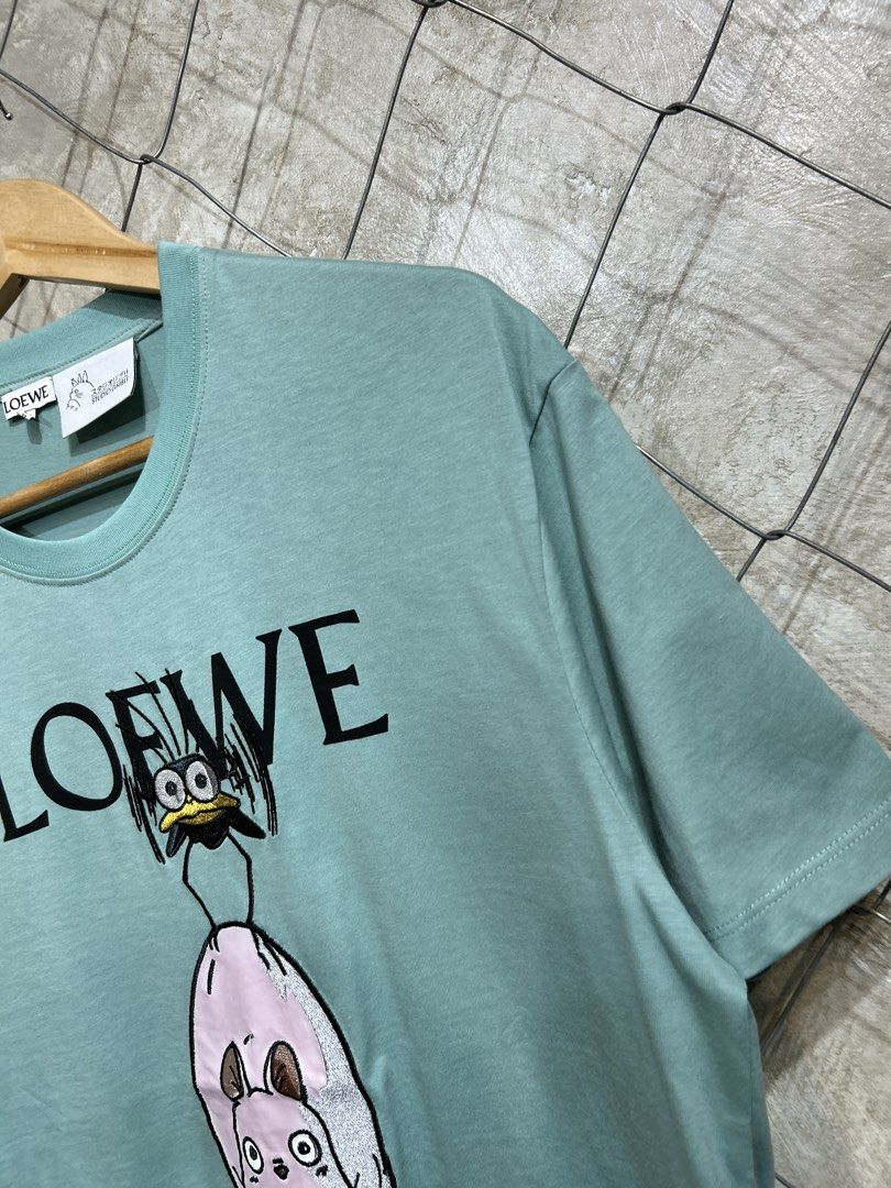 Loewe x Spirited Away T-shirt (Category: Tshirts & Polo Shirts ) located in Manila. Submitted by ardobe.mnl (Listing ID 1439465374, Image 3). Description: Loewe x Studio Ghibli Green Tee. Size: Large Dimes: 21x28 Condition: Good asnew Flaw: None! Dm to purchase! 📥.