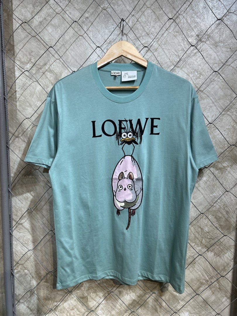 Loewe x Spirited Away T-shirt (Category: Tshirts & Polo Shirts ) located in Manila. Submitted by ardobe.mnl (Listing ID 1439465374, Image 1). Description: Loewe x Studio Ghibli Green Tee. Size: Large Dimes: 21x28 Condition: Good asnew Flaw: None! Dm to purchase! 📥.