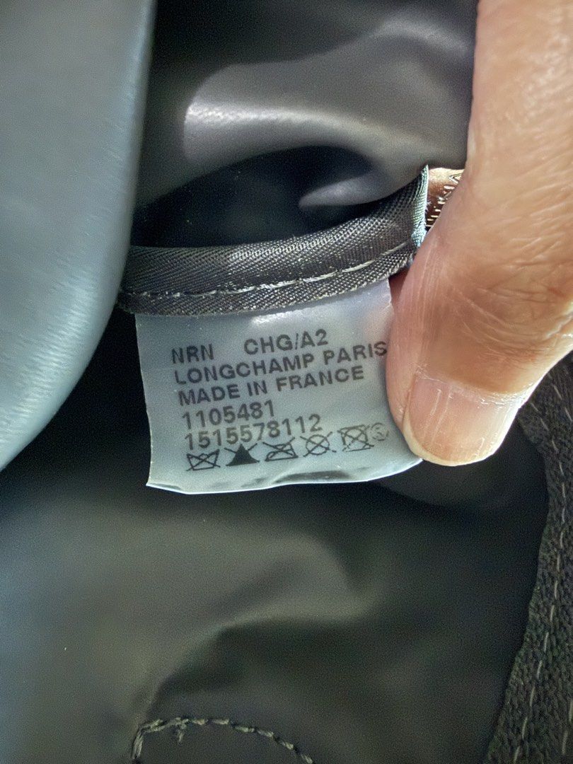 Longchamp Le Pliage Neo Medium (Category: Luxury Bags & Wallets) located in Quezon City. Submitted by rosell.xoxo (Listing ID 1439490515, Image 2). Description: ✨ Product Details & Features Brand: Longchamp Paris Color: Graphite / Dark Gray Origin: Made in France (Verified by internal clear tag) Interior: Clean interior and comes with a strap ( not adjustable) Exterior: with minimal signs of wear, corners with minor rubbing (normal for Le Pliage 