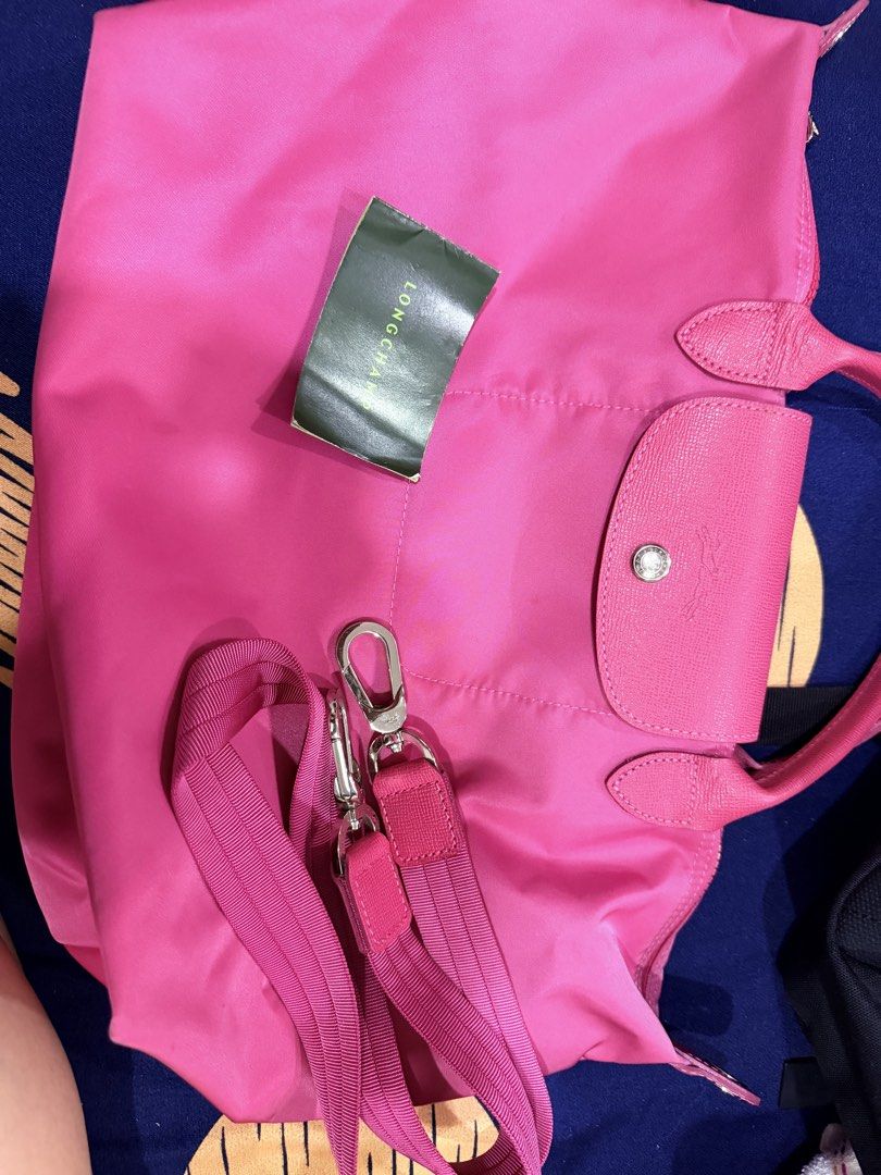Longchamp Le Pliage Tote Bag - Pink (Category: Luxury Bags & Wallets) located in Manila. Submitted by royalmoon_9d998f (Listing ID 1439571734, Image 1). Description: - Authentic Longchamp Le Pliage tote bag - Color: Pink - Features flap closure with snap - Leather handles - Detachable shoulder strap included - Includes Longchamp tag - Ideal for everyday or travel use.