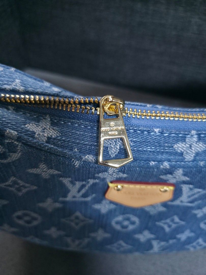 Louis Vuitton Denim Bag (Category: Luxury Bags & Wallets) located in General Trias. Submitted by roselle2230 (Listing ID 1439517993, Image 3). Description: - Authentic Louis Vuitton denim bag - Features the classic LV monogram - Includes a detachable coin purse - Gold zipper and leather accents - Adjustable strap - Interior tag code: GC9420.