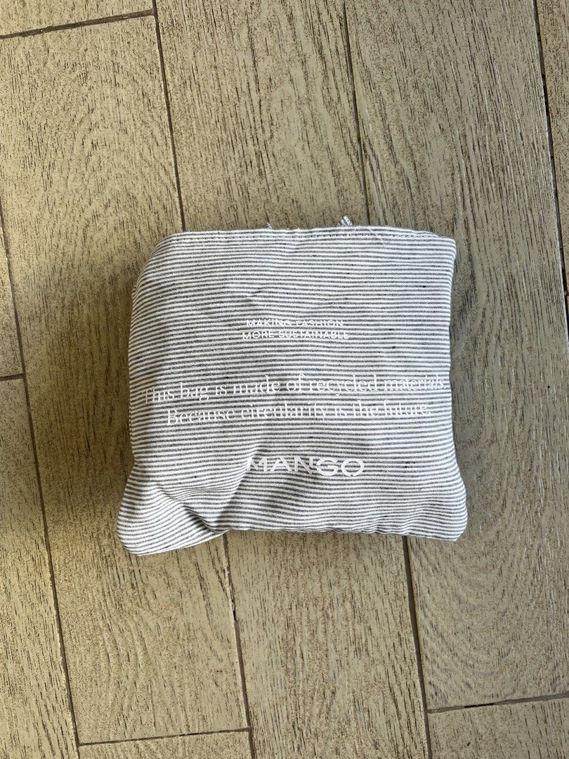 Mango Packaway Striped Tote Bag grey color large (Category: Tote Bags) located in Quezon City. Submitted by a__line.ph (Listing ID 1439606642, Image 2). Description: - color bluish grey - Mango striped tote bag - Rectangular shape - Large capacity - Made from recycled material - Features two handles - Mango label on front.