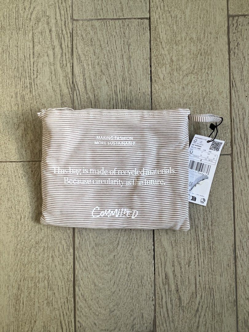Mango packaway Striped Tote Bag beige color medium (Category: Tote Bags) located in Quezon City. Submitted by a__line.ph (Listing ID 1439606714, Image 2). Description: - beige color - i have 2 pcs for sale (1 used, 1 brand new) - Mango tote bag - Made with recycled materials - Striped design - Two handles - Mango logo label - Includes a matching pouch - Sustainable and eco-friendly.
