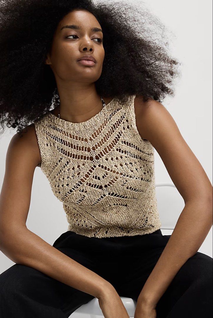Marks & Spencer Metallic Vest With Cotton (Category: Sleeveless) located in Manila. Submitted by hellothere2012 (Listing ID 1439486422, Image 1). Description: This metallic-thread knitted sleeveless vest top adds a subtle shimmer to your everyday outfits. It’s a regular fit with a cropped length, perfect for layering over shirts or pairing with high-waisted trousers. The open-stitch texture and slash neckline create a fresh, modern feel, while th
