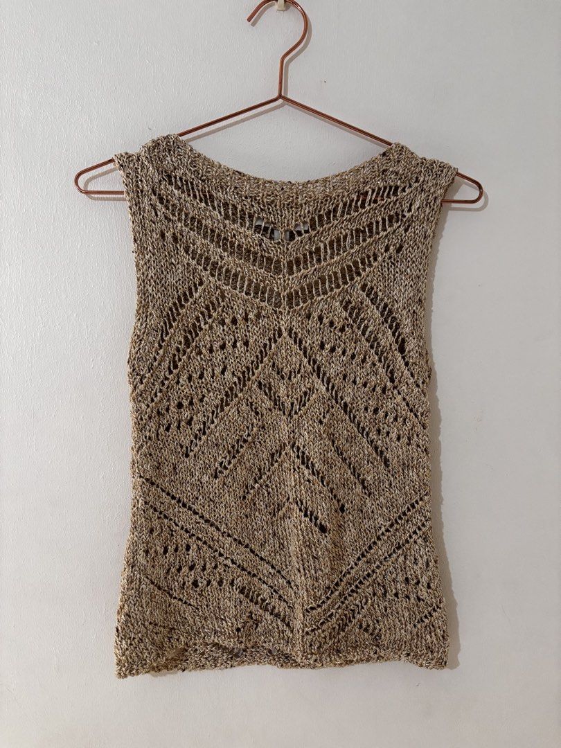 Marks & Spencer Metallic Vest With Cotton (Category: Sleeveless) located in Manila. Submitted by hellothere2012 (Listing ID 1439486422, Image 3). Description: This metallic-thread knitted sleeveless vest top adds a subtle shimmer to your everyday outfits. It’s a regular fit with a cropped length, perfect for layering over shirts or pairing with high-waisted trousers. The open-stitch texture and slash neckline create a fresh, modern feel, while th