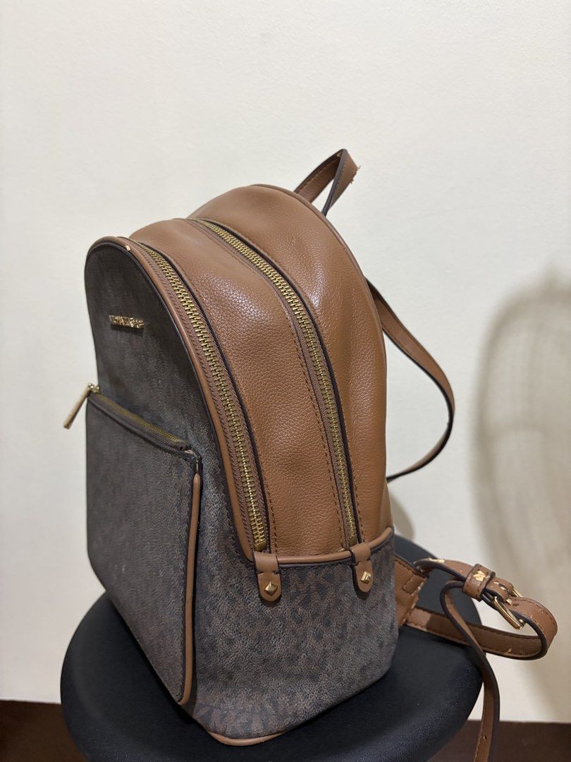 Michael Kors Adina Backpack (Category: Backpacks) located in Manila. Submitted by kiziah1234 (Listing ID 1439590226, Image 2). Description: - all zippers are still working - from the US (gifted to me) - rfs: not gonna use anymore - loc: mendiola, mnl - see photos for damages - open for nego :) .