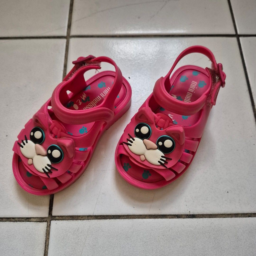 Mini Melissa Pink Cat Baby Toddler Sandals (Category: Babies & Kids Fashion) located in Quezon City. Submitted by oursnowyours (Listing ID 1439528791, Image 1). Description: - Pink Mini Melissa sandals with a cute cat design. - Features a secure strap. - Size: US 6, BRA 19, EUR 21, JPN 12.5. - Made in Brazil. - refer to pics for size guide.