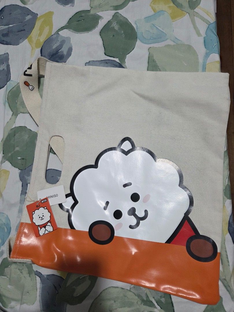 Miniso RJ BT21 Tote Bag (Category: Tote Bags) located in Quezon City. Submitted by panchie32 (Listing ID 1439578126, Image 1). Description: Selling my RJ BT21 Miniso Tote Bag. It still has the tags. Please see photos for item's condition. RFS: Never used it. Note: The bag has been in storage for quite a while and may need to be washed as its not as white as it originally was. 📍 Location: Brgy. Kaligayahan, Novaliches, Quezon City ✅ Open for meet