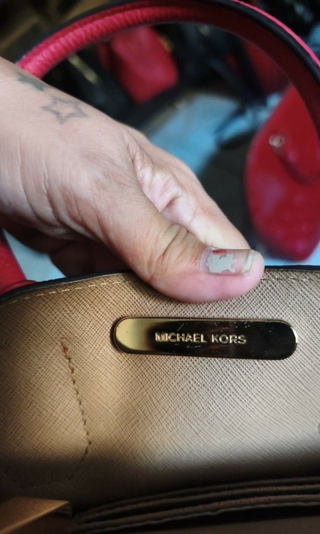 Mk Mercier (Category: Luxury Bags & Wallets) located in Manila. Submitted by bellissima05 (Listing ID 1437562529, Image 2). Description: Featuring a chic and fabulous style, this MICHAEL Michael Kors tote has a high appeal. Crafted from red pebbled leather, the bag features dual top handles, a removable shoulder strap, and a padlock. It opens to a spacious leather and nylon interior, which is divided by a zipper compartment. Length : 21 cm Width 