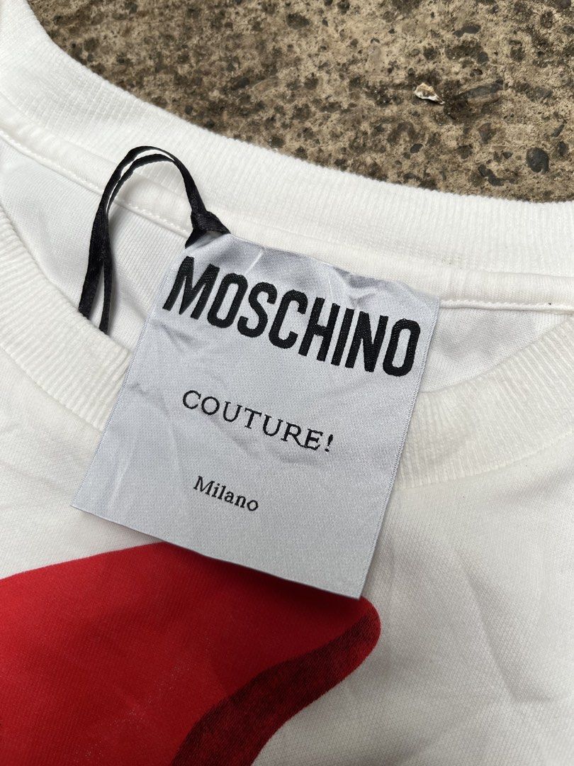 Moschino Couture T-shirt (Category: Shirts) located in Davao. Submitted by streetsight (Listing ID 1439542912, Image 2). Description: MOSCHINO TSHIRT 📌GRAPHIC PRINT OF RED DRESS EXCELLENT CONDITION SIZE LARGE WIDTH – 21 LENGTH 31 📍700.