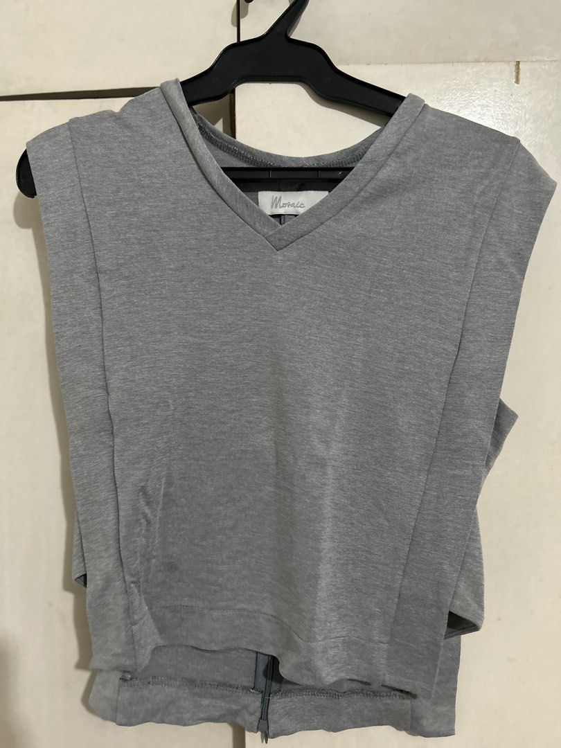 Mosiac Sleeveless Top (Category: Sleeveless) located in Quezon City. Submitted by samthingsshop (Listing ID 1439576033, Image 1). Description: - Gray sleeveless top from Mosiac PH - Features a V-neck - Zipper closure at the back - Unique split design at the bottom - Made of comfortable fabric - Simple yet stylish design - fits Medium size - Worn once and original price 1000+.