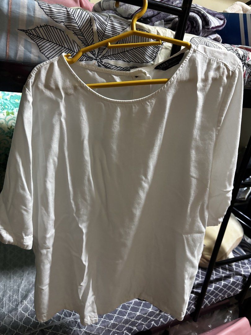 M&S White Blouse (Category: Blouses) located in Manila. Submitted by joahnaf (Listing ID 1439478546, Image 1). Description: - M&S white blouse - Round neckline - Short sleeves - Lightweight fabric - Simple, classic design - Versatile for various occasions.