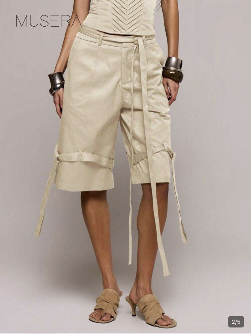 MUSERA Strapless Tube Top and Shorts Set (Category: Sets or Coordinates) located in Taguig. Submitted by gheii (Listing ID 1439474965, Image 2). Description: - MUSERA strapless top and shorts set - Top: Pleated design - Shorts: Tailored fit, belt loops, tie detail - Color: Neutral - Style: Chic and modern look - Perfect for versatile outfits.