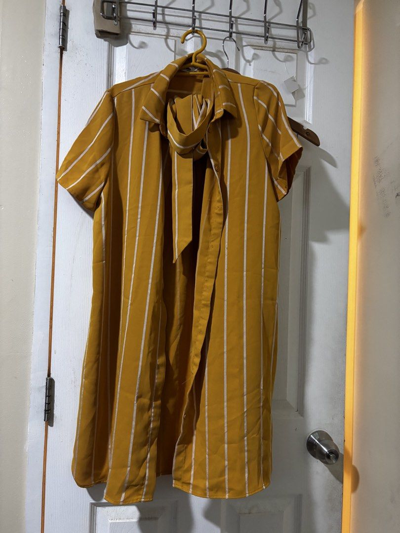 Mustard Yellow Striped Dress (Category: Dresses) located in Manila. Submitted by joahnaf (Listing ID 1439477477, Image 1). Description: - Mustard yellow dress - White vertical stripes - Tie-neck detail - Short sleeves - Lightweight fabric - Relaxed fit - Knee-length - Versatile for casual or dressed-up looks.