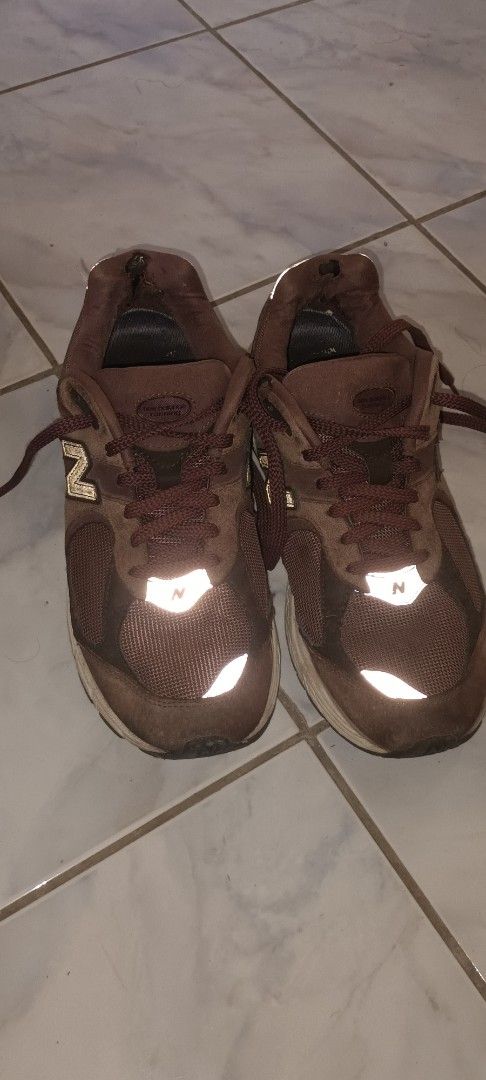 New Balance 2002R Brown Sneakers (Category: Sneakers) located in Manila. Submitted by ellecarl7650522 (Listing ID 1439432535, Image 1). Description: - New Balance 2002R sneakers - Brown colorway - Mesh upper - New Balance logo on the side - 2002R model visible - Off-white soles - Pre-owned condition Issues in the pics.