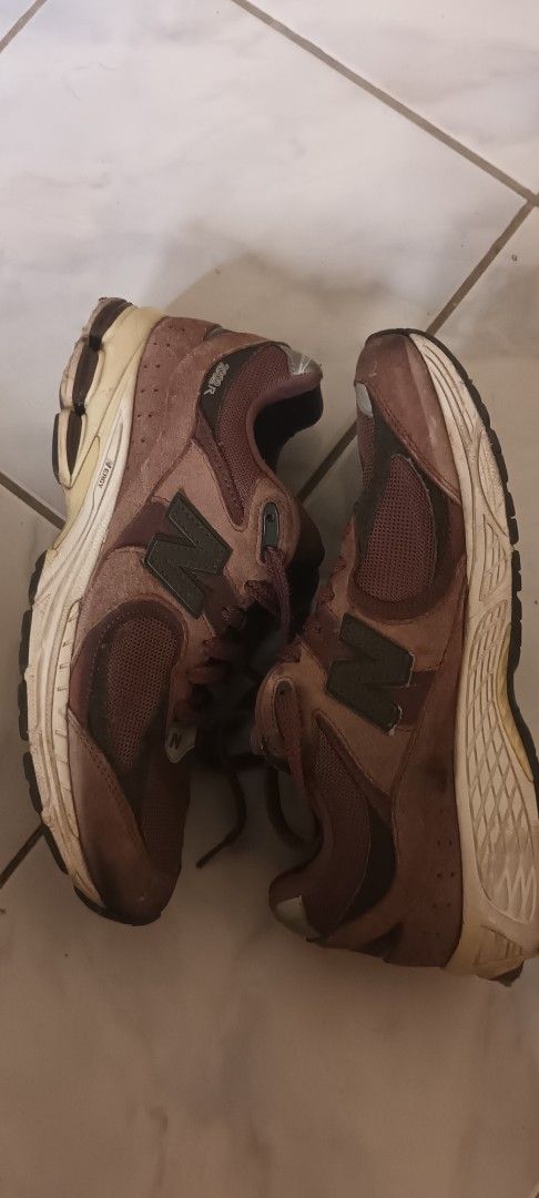New Balance 2002R Brown Sneakers (Category: Sneakers) located in Manila. Submitted by ellecarl7650522 (Listing ID 1439432535, Image 2). Description: - New Balance 2002R sneakers - Brown colorway - Mesh upper - New Balance logo on the side - 2002R model visible - Off-white soles - Pre-owned condition Issues in the pics.