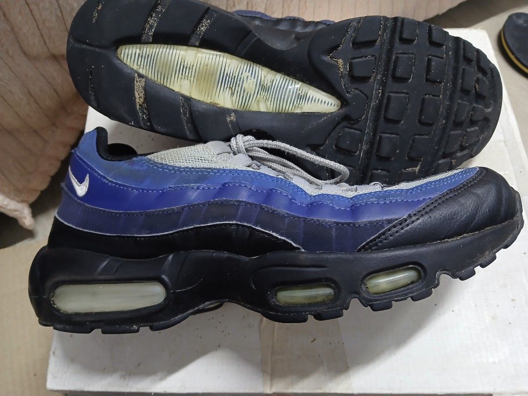 Nike Air Max 95 - Blue/Grey (Category: Sneakers) located in Davao. Submitted by lixzel (Listing ID 1439525160, Image 3). Description: - Nike Air Max 95 sneakers - Color: Blue, Grey, Black - Size: US 9, UK 8, EUR 42.5, CM 27 - Visible Air Max cushioning - Signs of wear on soles and uppers - Nike Air branding on insoles.