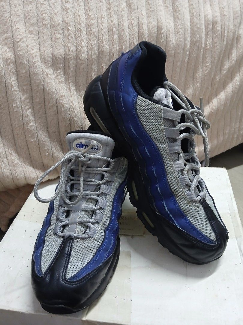 Nike Air Max 95 - Blue/Grey (Category: Sneakers) located in Davao. Submitted by lixzel (Listing ID 1439525160, Image 1). Description: - Nike Air Max 95 sneakers - Color: Blue, Grey, Black - Size: US 9, UK 8, EUR 42.5, CM 27 - Visible Air Max cushioning - Signs of wear on soles and uppers - Nike Air branding on insoles.