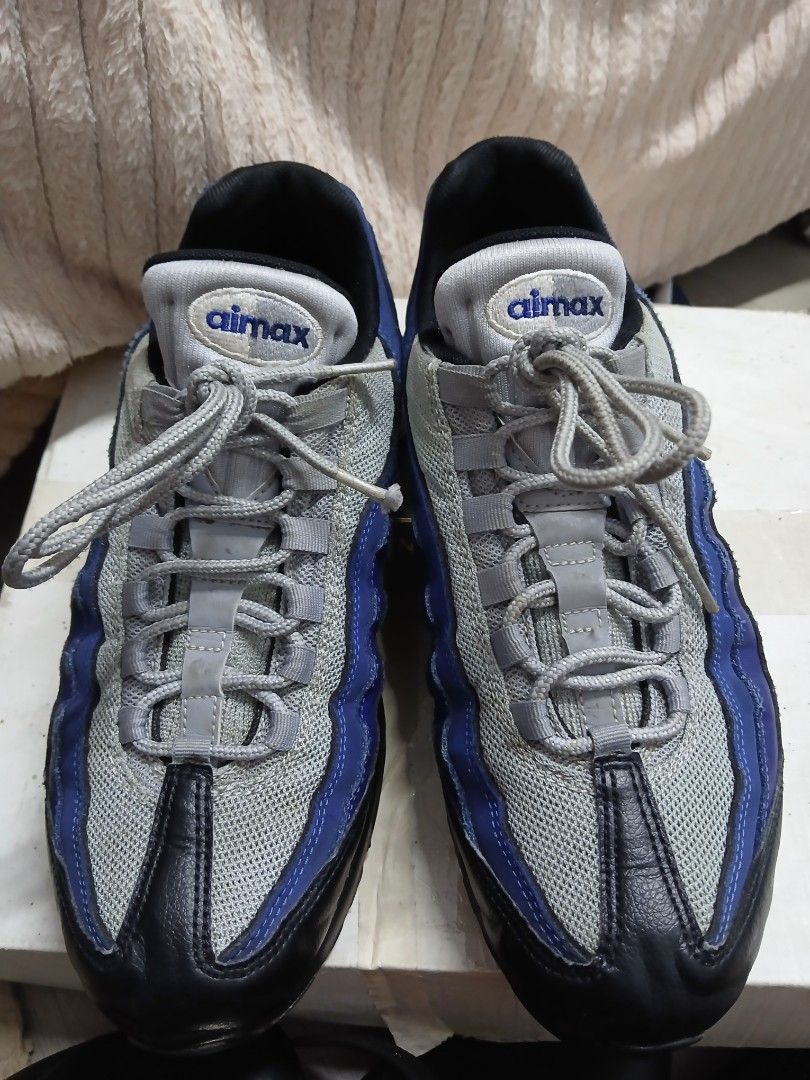 Nike Air Max 95 - Blue/Grey (Category: Sneakers) located in Davao. Submitted by lixzel (Listing ID 1439525160, Image 2). Description: - Nike Air Max 95 sneakers - Color: Blue, Grey, Black - Size: US 9, UK 8, EUR 42.5, CM 27 - Visible Air Max cushioning - Signs of wear on soles and uppers - Nike Air branding on insoles.
