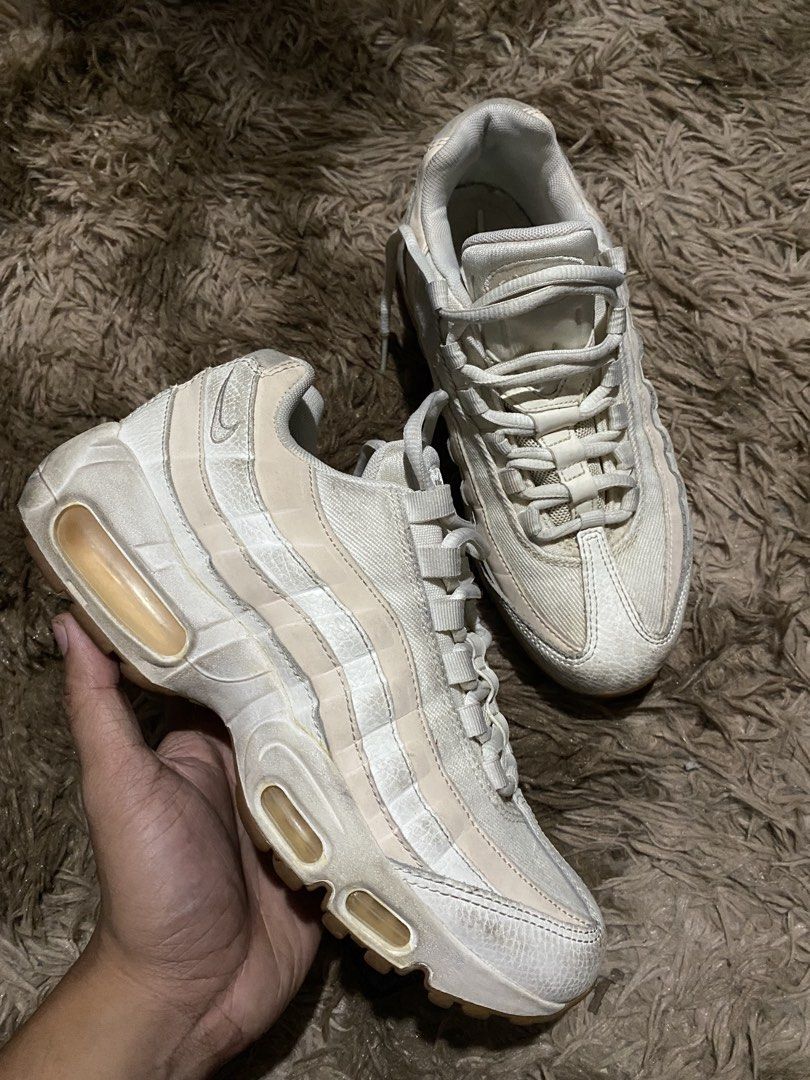 Nike Air Max 95 White Sneakers (Category: Sneakers) located in Iligan City. Submitted by trickorthrift1 (Listing ID 1439591641, Image 2). Description: - Nike Air Max 95 sneakers - White/pink colorway - Iconic Air Max bubble sole - Laces are intact - Nike logo visible - Brown soles Need wash Leather Size 38.5/7.5.