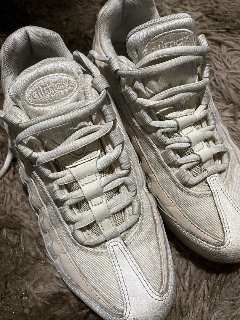 Nike Air Max 95 White Sneakers (Category: Sneakers) located in Iligan City. Submitted by trickorthrift1 (Listing ID 1439591641, Image 3). Description: - Nike Air Max 95 sneakers - White/pink colorway - Iconic Air Max bubble sole - Laces are intact - Nike logo visible - Brown soles Need wash Leather Size 38.5/7.5.