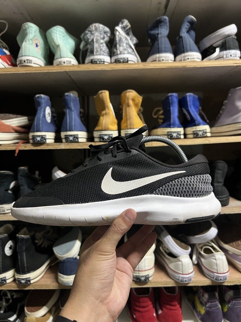 Nike Flex Experience Run 7 Black (Category: Sneakers) located in Manila. Submitted by thrift_ko_yan (Listing ID 1439565796, Image 2). Description: - Nike Flex Experience Run 7 - Color: Black with white accents - Size: US 8.5, UK 7.5, EUR 42, 26.5 cm - Features: Mesh upper, white sole, Nike swoosh logo - Condition: Used, some wear on soles.